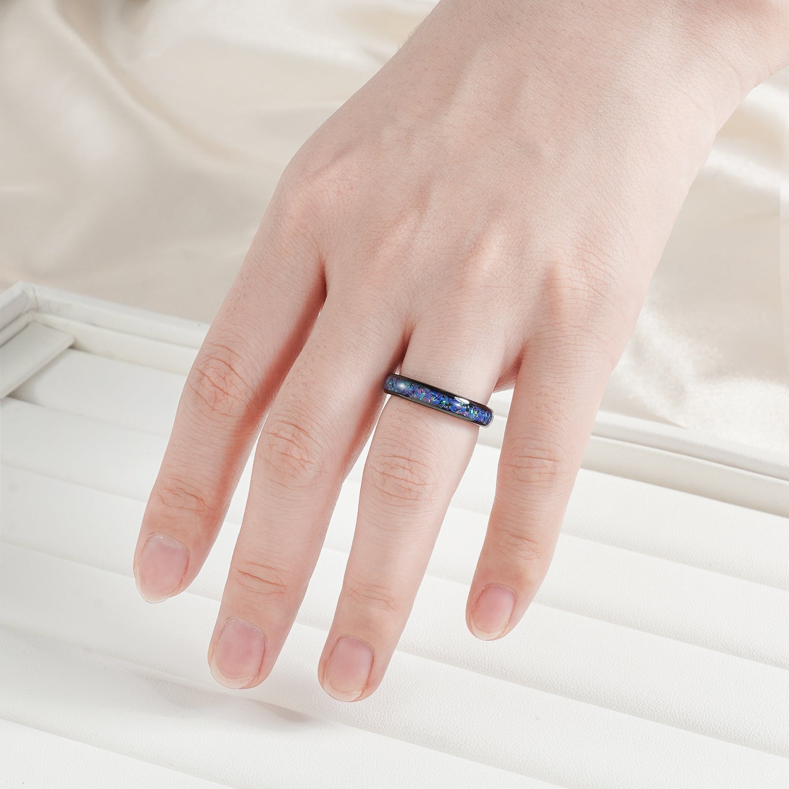 Tungsten ring with opal and cosmic gemstone details