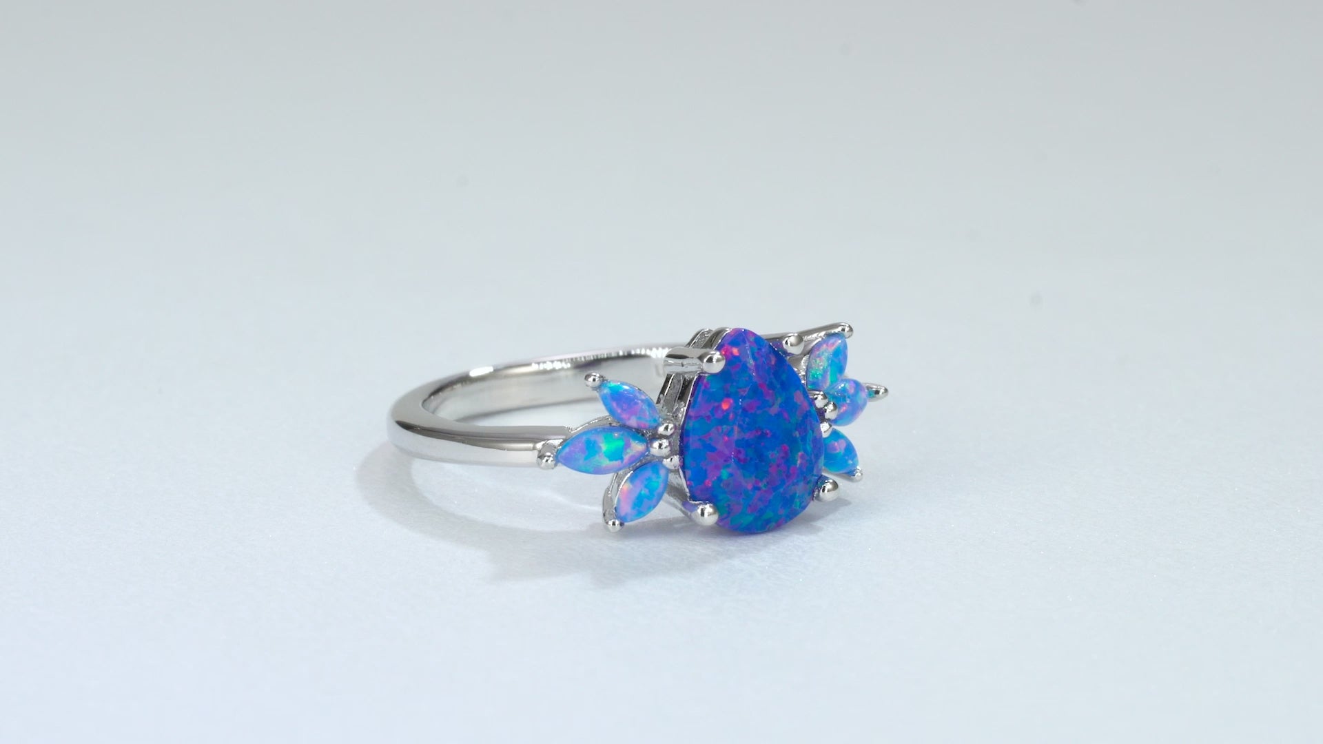 Blue fire opal ring in sterling silver with crystal accents