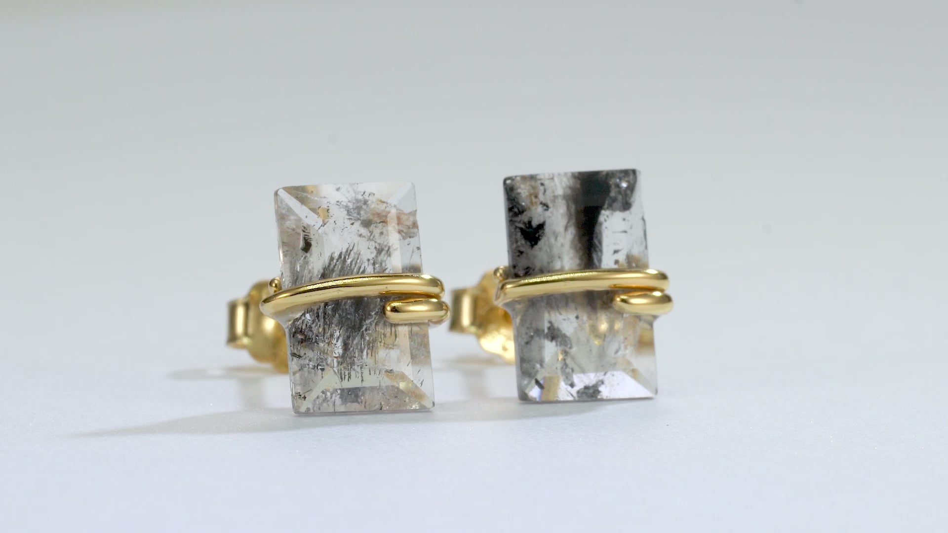 Salt and pepper diamond earrings with emerald cut design