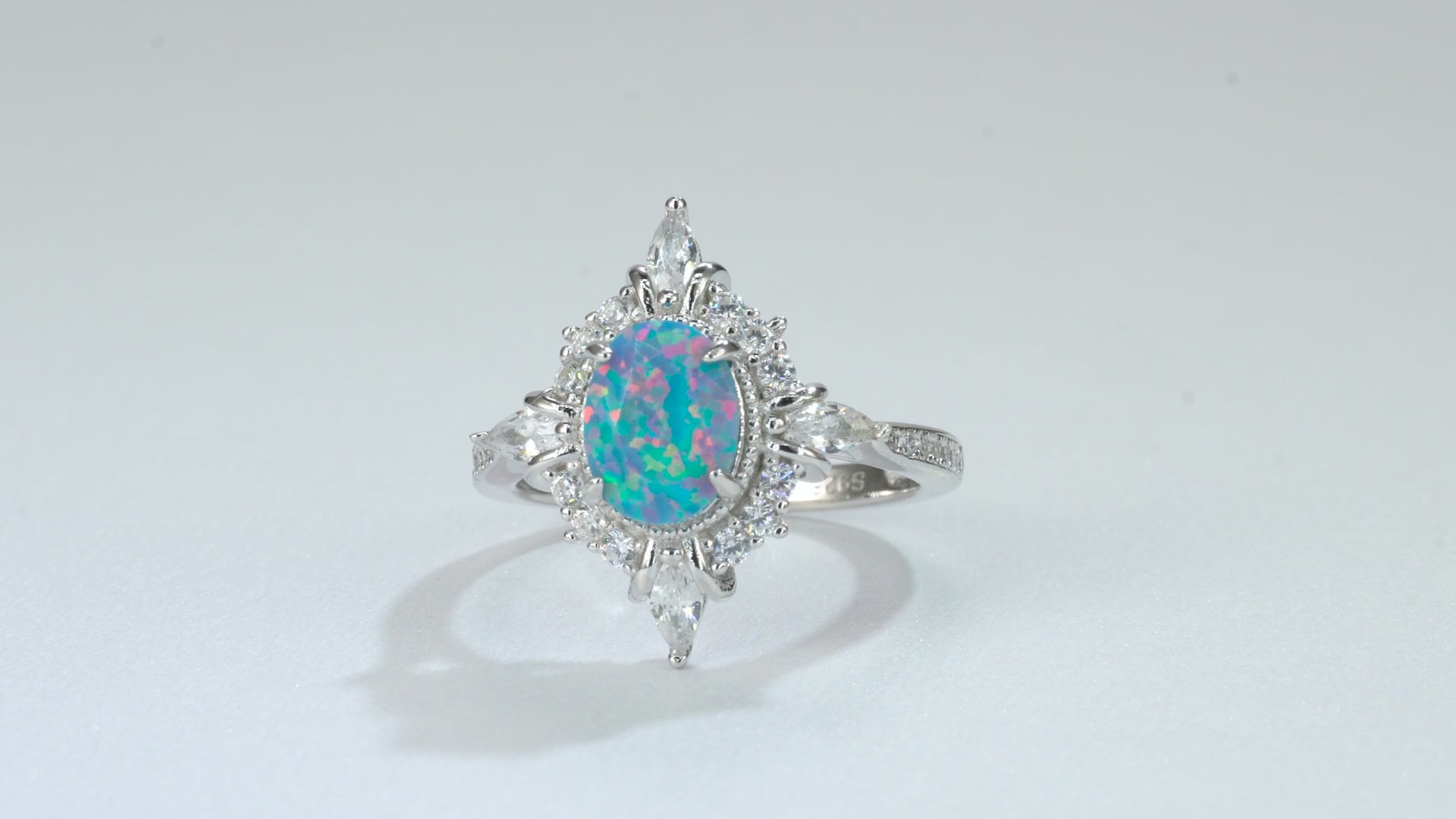 Blue fire opal ring with sterling silver band, handcrafted
