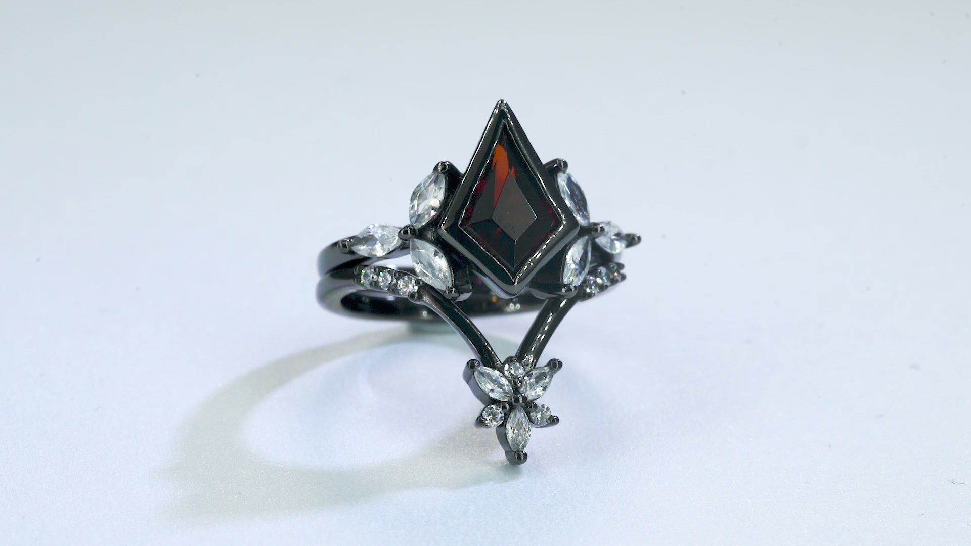 Garnet ring set in black gold vermeil with crystal accents