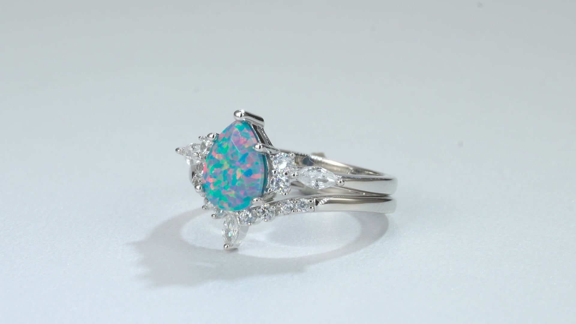 Blue fire opal ring with sterling silver band and crystals